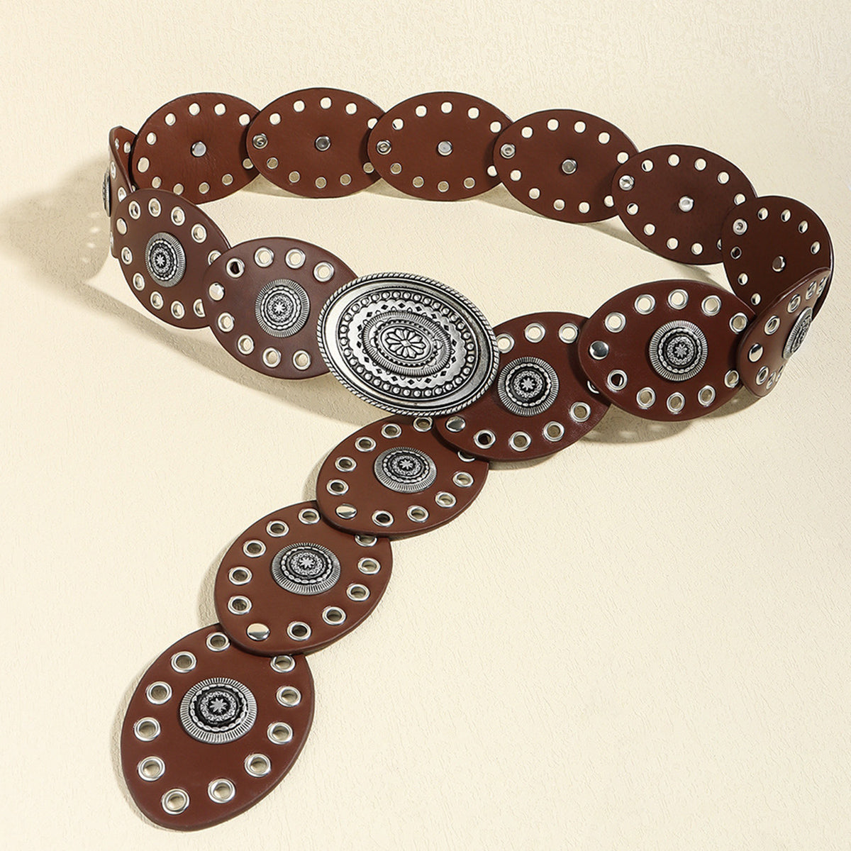 Dark brown vegan leather belt with large silver oval buckle and row of stud ovals