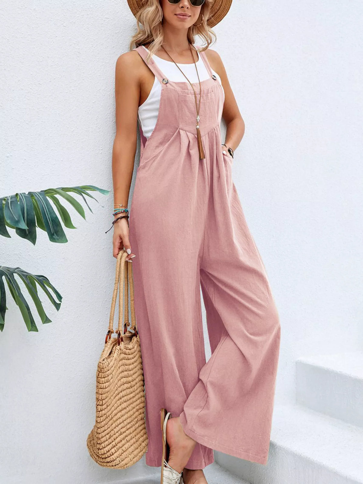 Pink wide-leg overalls with front bib pocket and adjustable shoulder straps