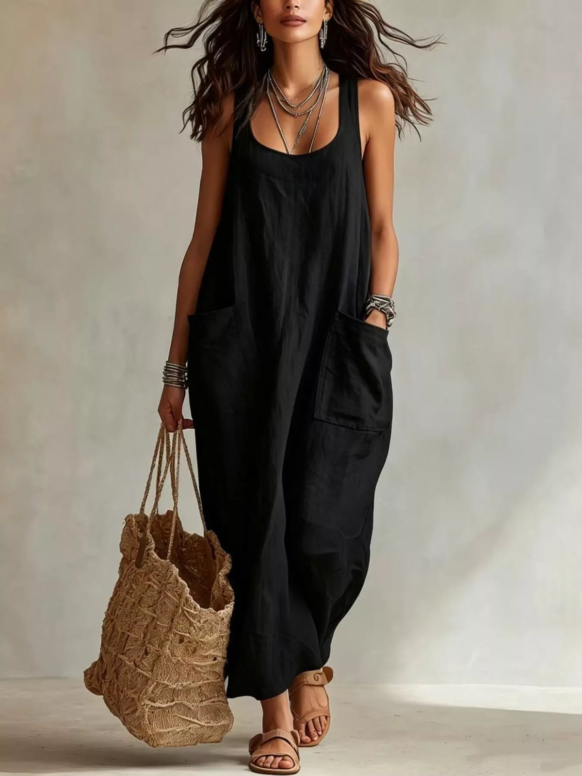 Black sleeveless scoop-neck maxi dress with side pockets and loose silhouette