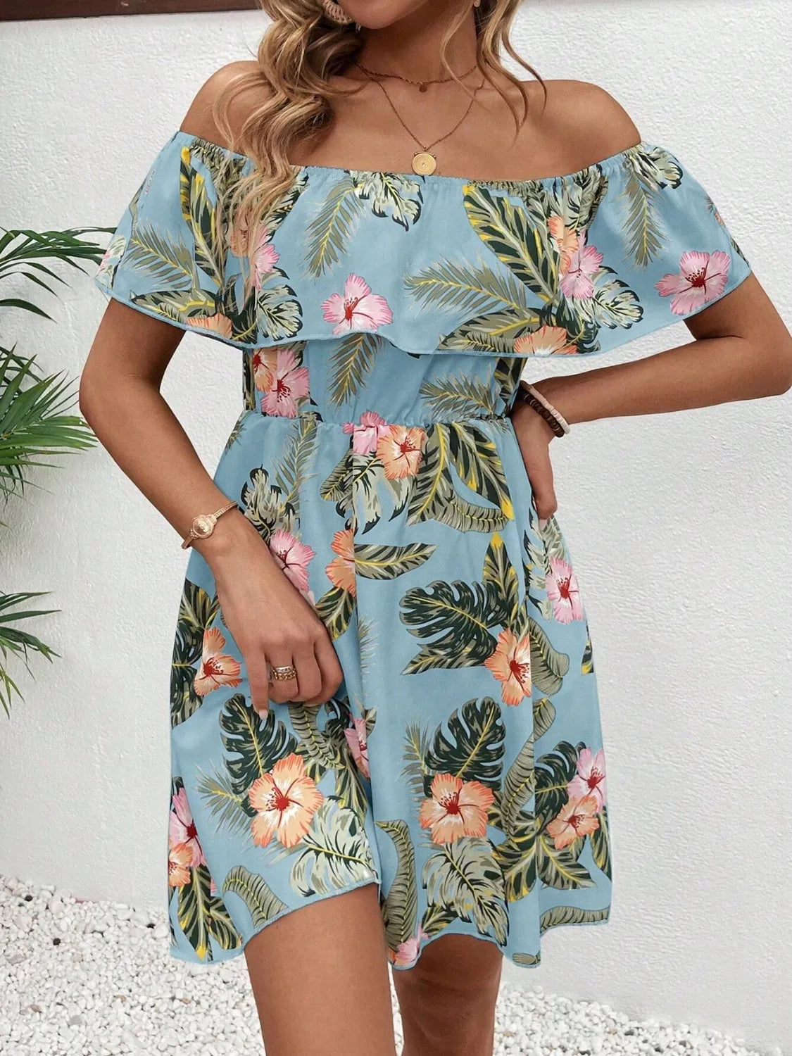 Printed off-shoulder mini dress with ruffled neckline in blue tropical hibiscus floral print by Trendsi