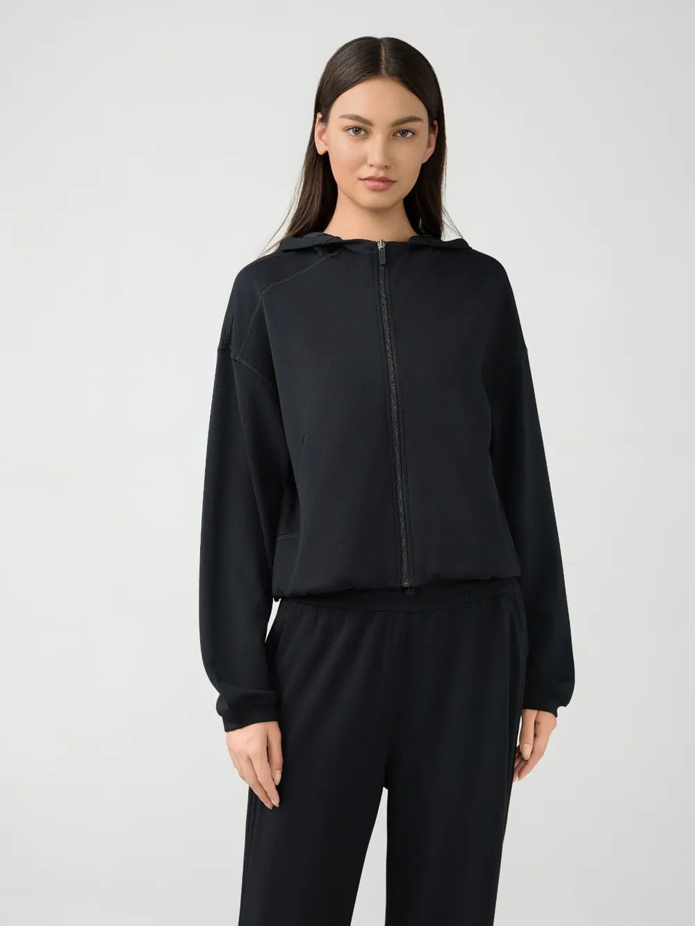 Black hooded active zip jacket with dropped shoulders and long sleeves