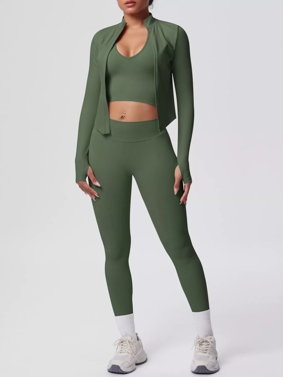 Three-piece workout set in dark green: sports bra, high-waist leggings, open long-sleeve jacket