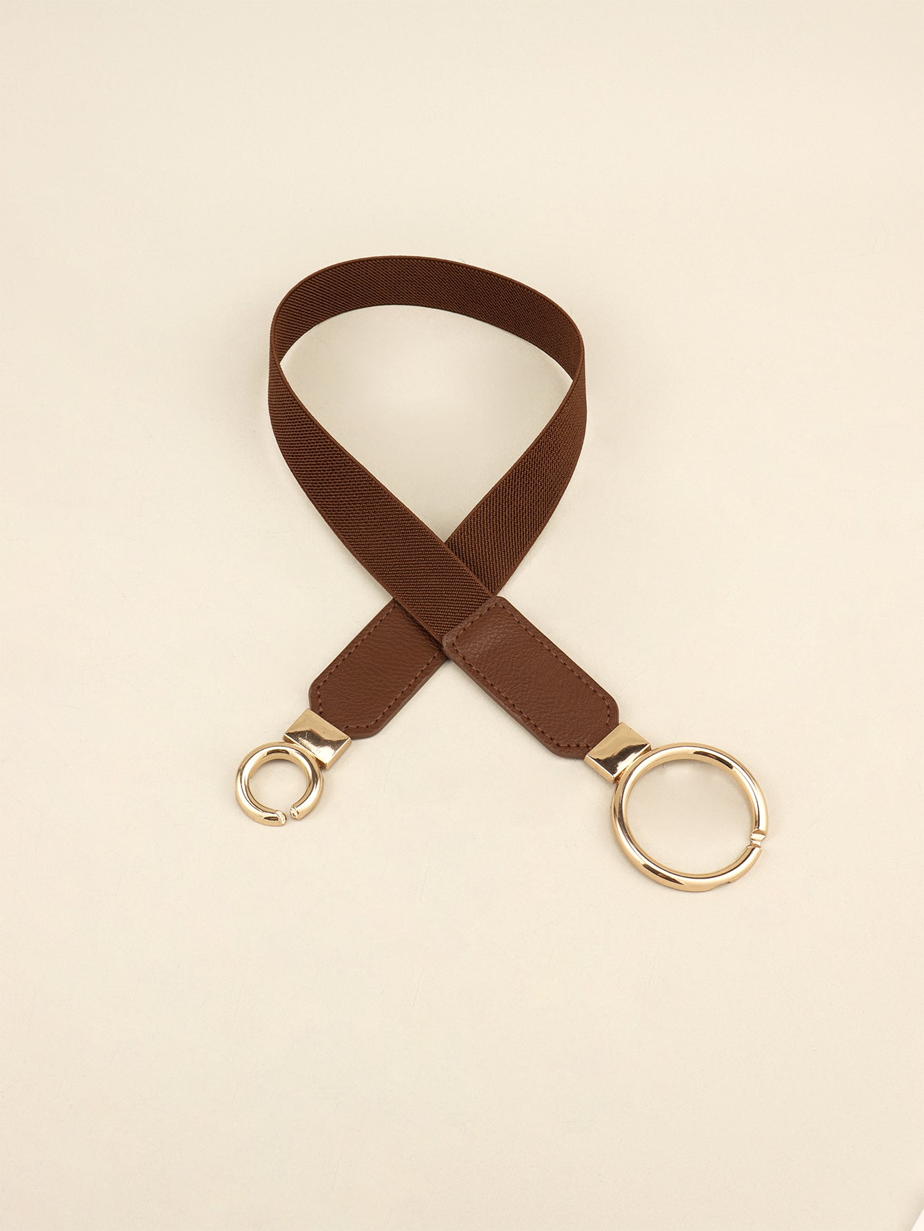 Dark brown elastic vegan leather belt with double ring buckle and loop ends