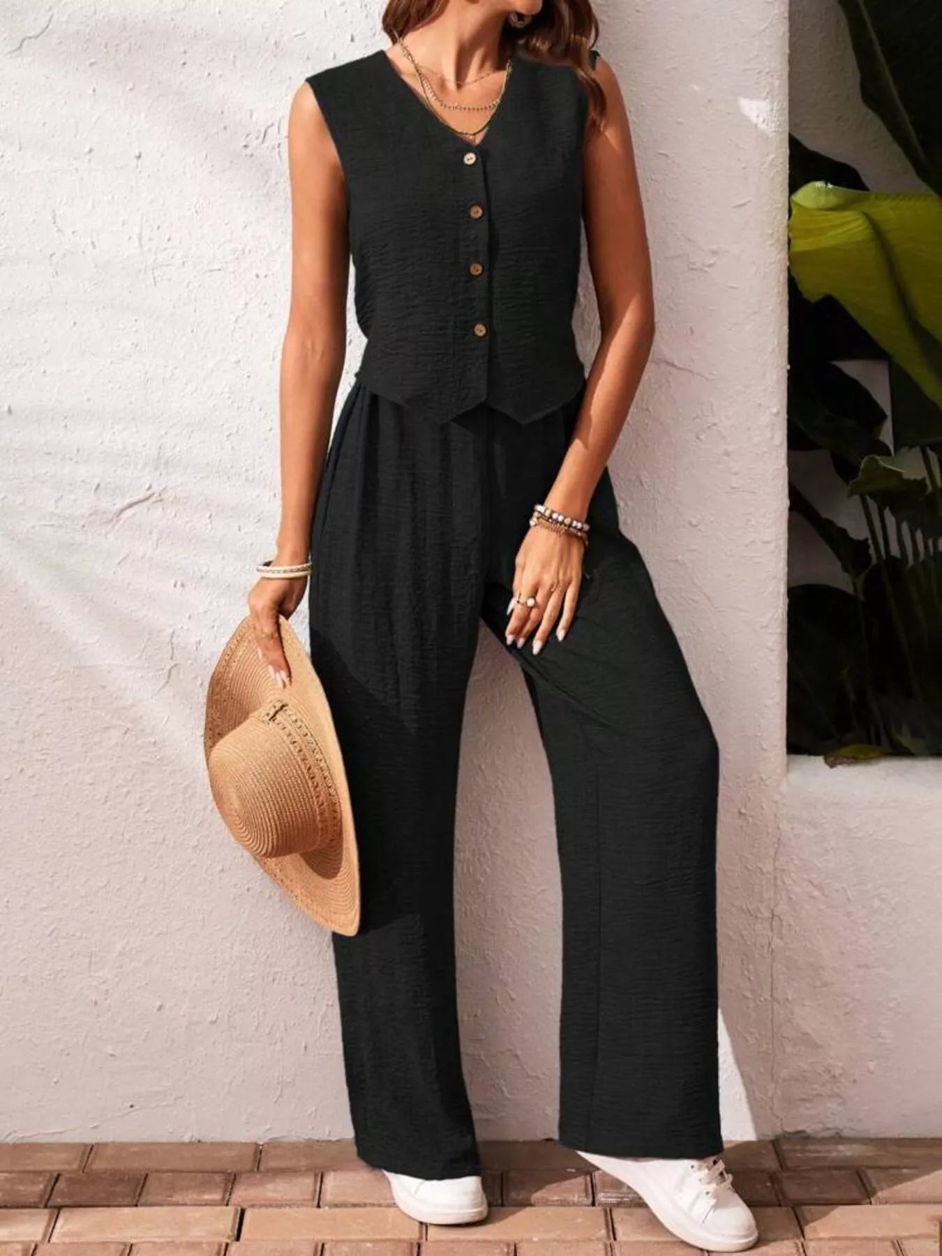 Black button-down vest and wide-leg pants set, sleeveless with front buttons