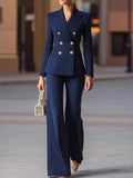 Navy pinstripe double-breasted blazer and wide-leg pants set with gold buttons.