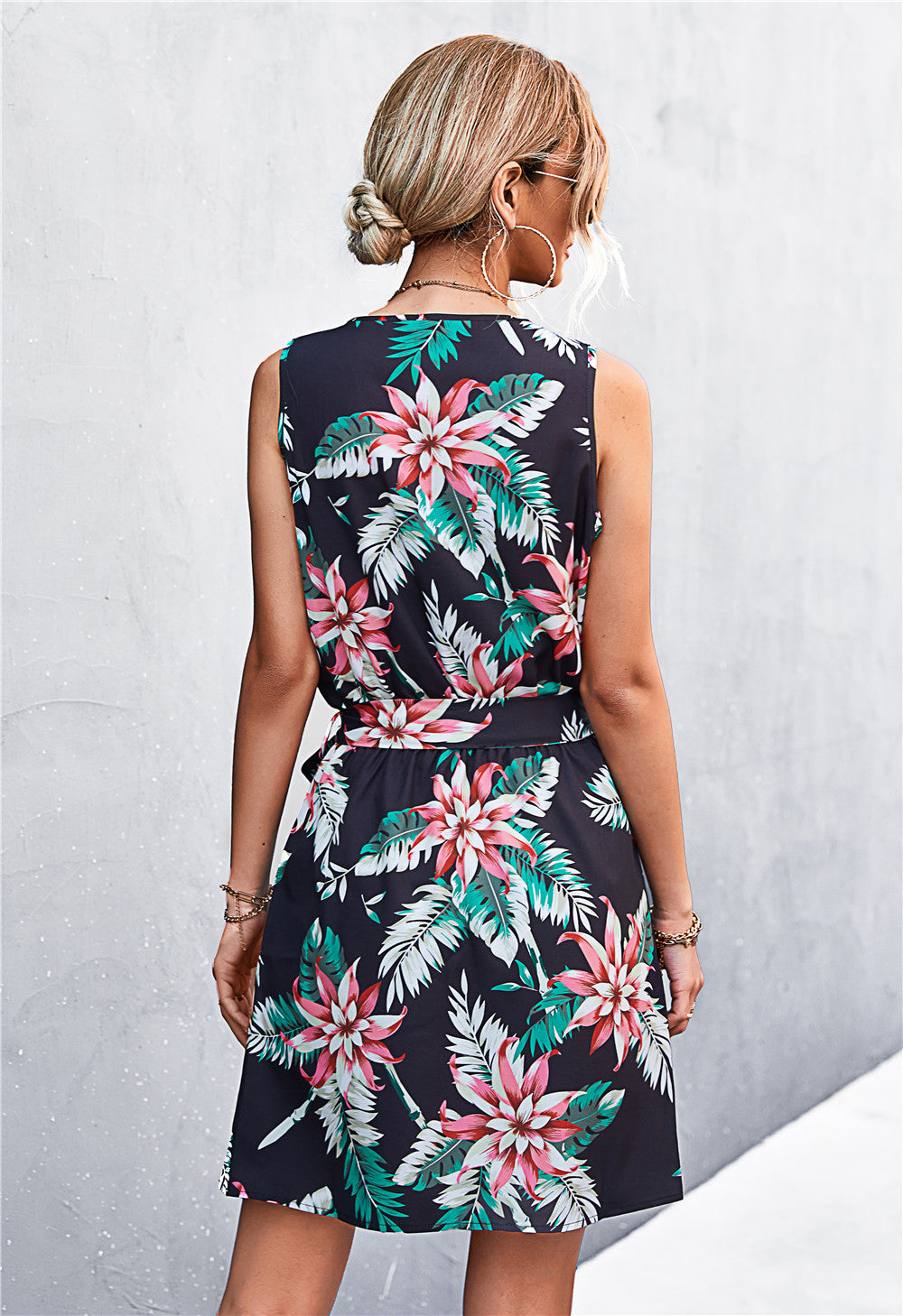 Floral printed zip-front belted sleeveless dress, back view, black with multicolor blooms
