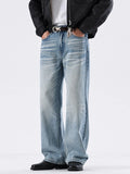 Washed sky-blue wide-leg jeans with faded whisker wash and wide straight legs