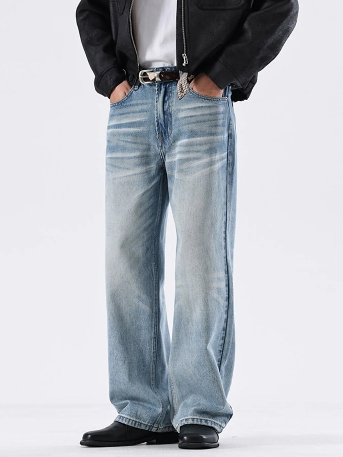 Washed sky-blue wide-leg jeans with faded whisker wash and wide straight legs