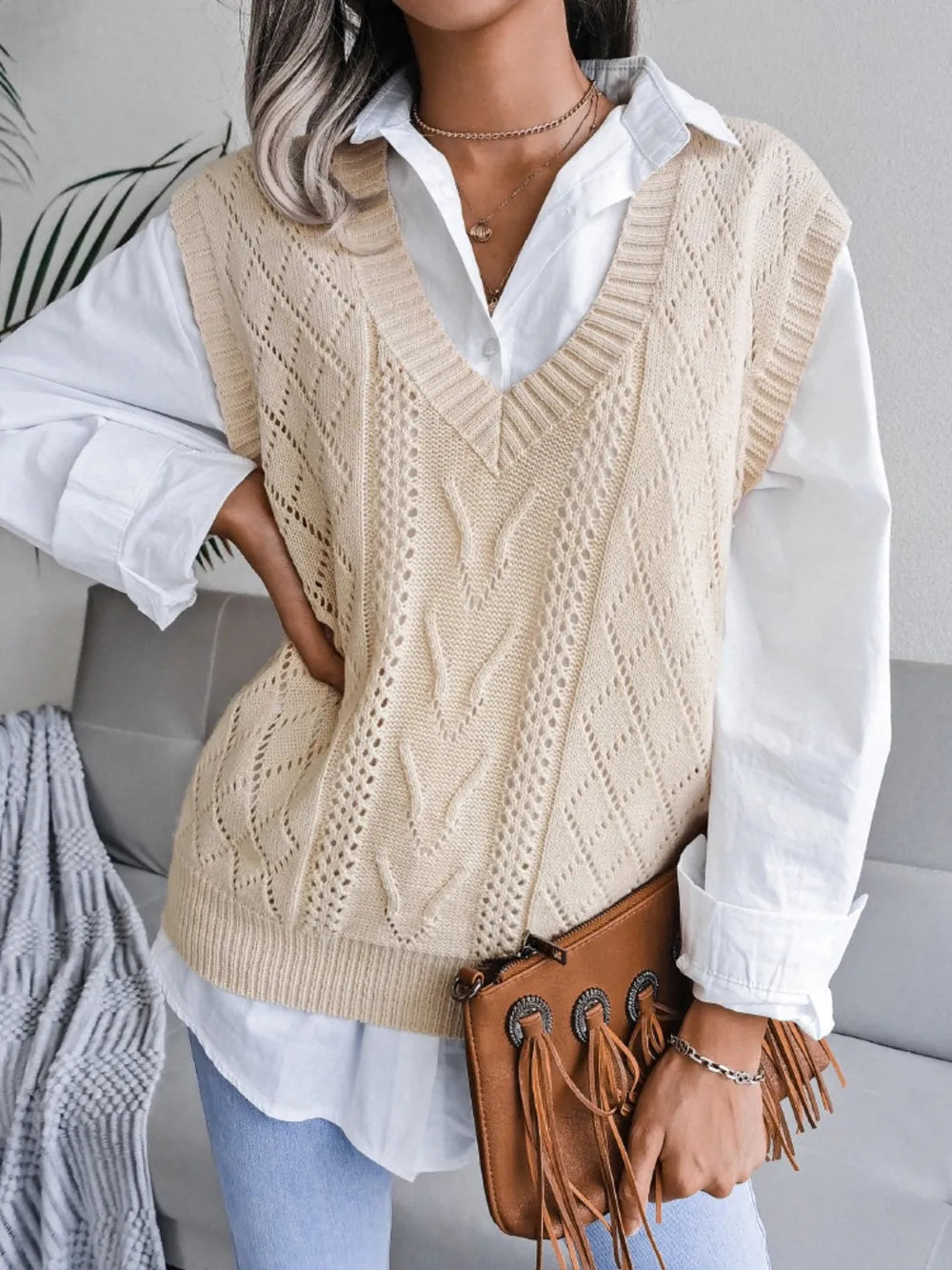 Cream openwork V-neck sweater vest, sleeveless knit with diamond openwork design.