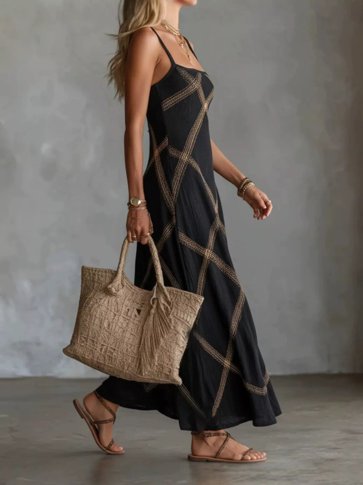 Black square-neck maxi dress with gold diamond lattice print, thin straps and flared skirt