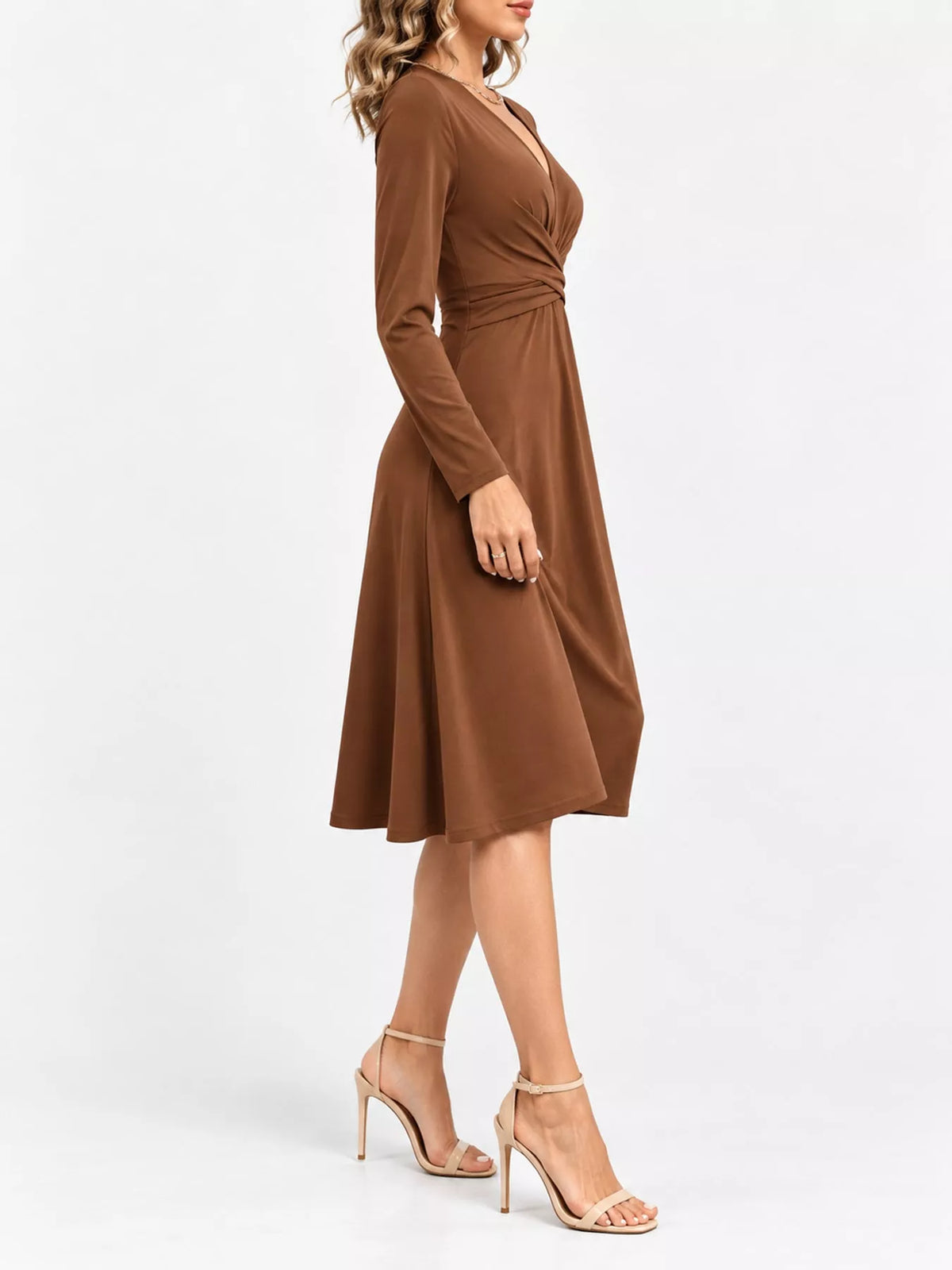 Tan ruched midi dress with V-neck and long sleeves, gathered waist and flared skirt.