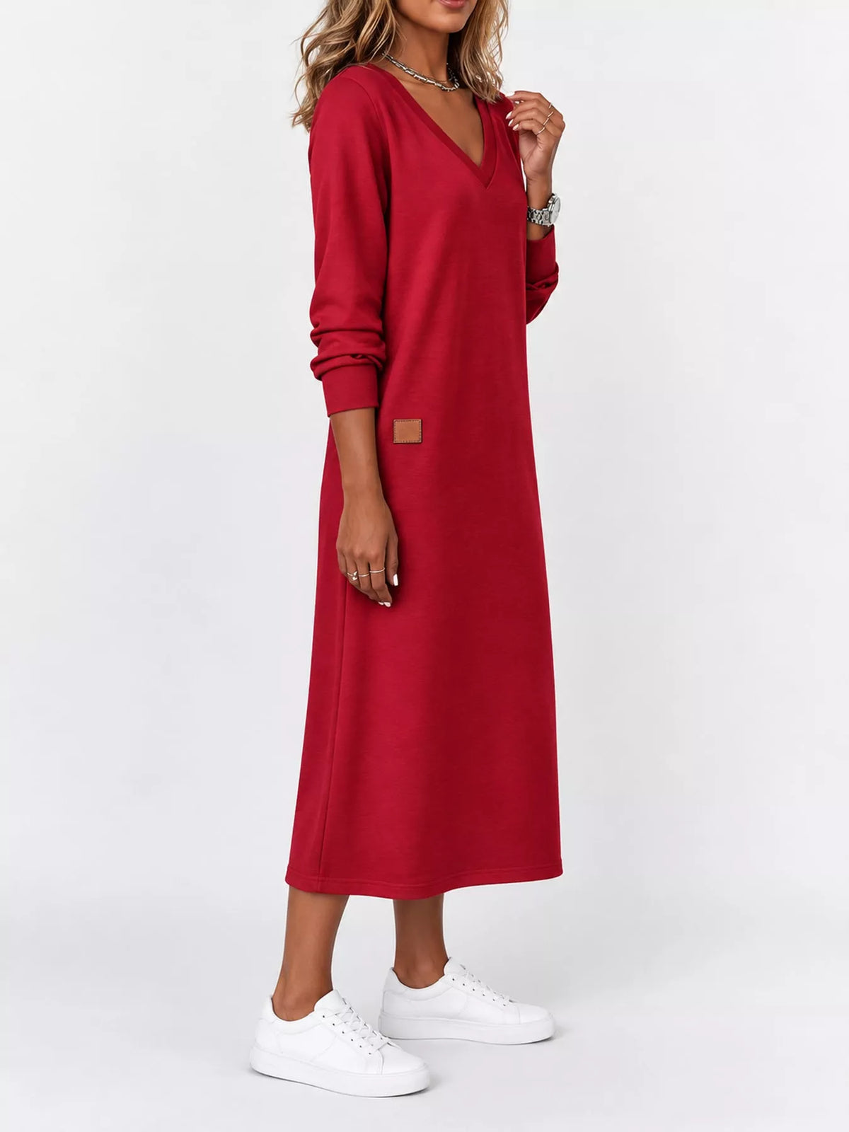 Red V-neck long-sleeve midi dress with square patch and white sneakers