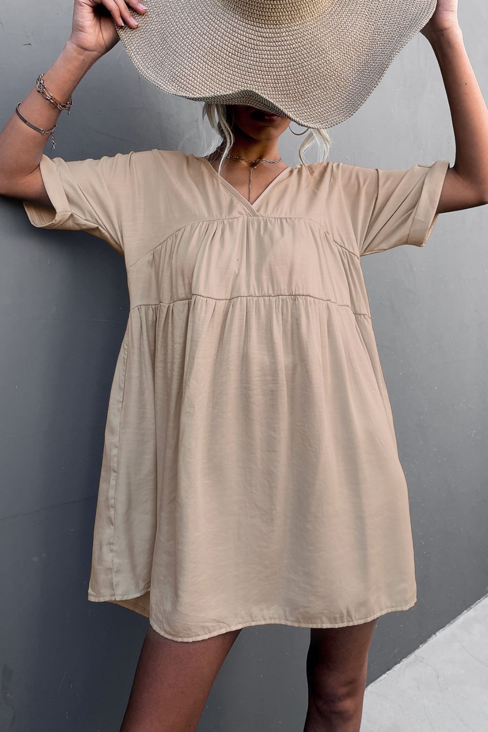 Apricot tiered V-neck mini dress with short sleeves and gathered bodice