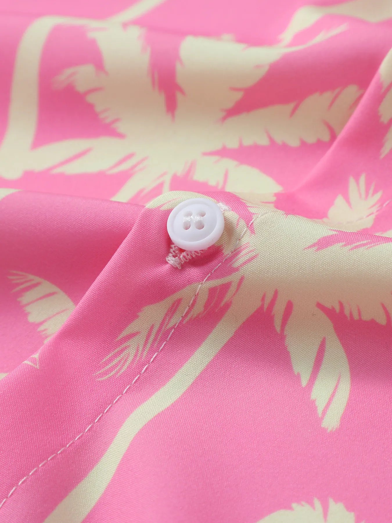 Dusty pink palm print shirt with white button at placket
