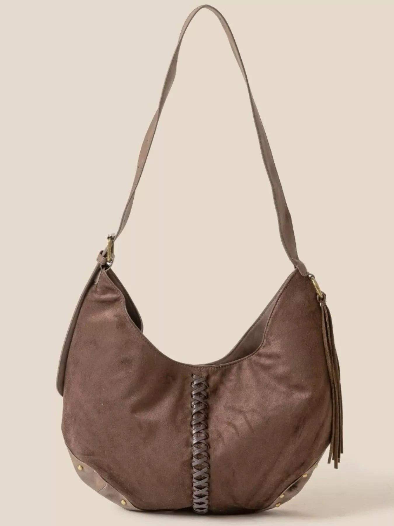 Brown suede hobo shoulder bag with braided center detail and tassel fringe