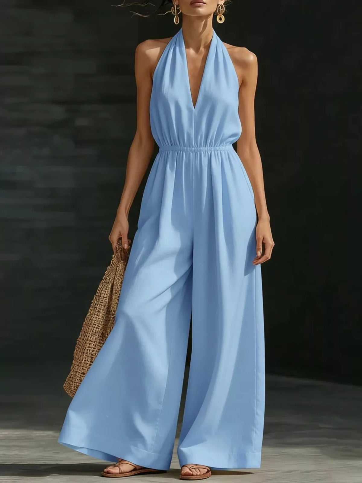 Sky blue halter-neck wide-leg jumpsuit with deep V neckline and gathered waist