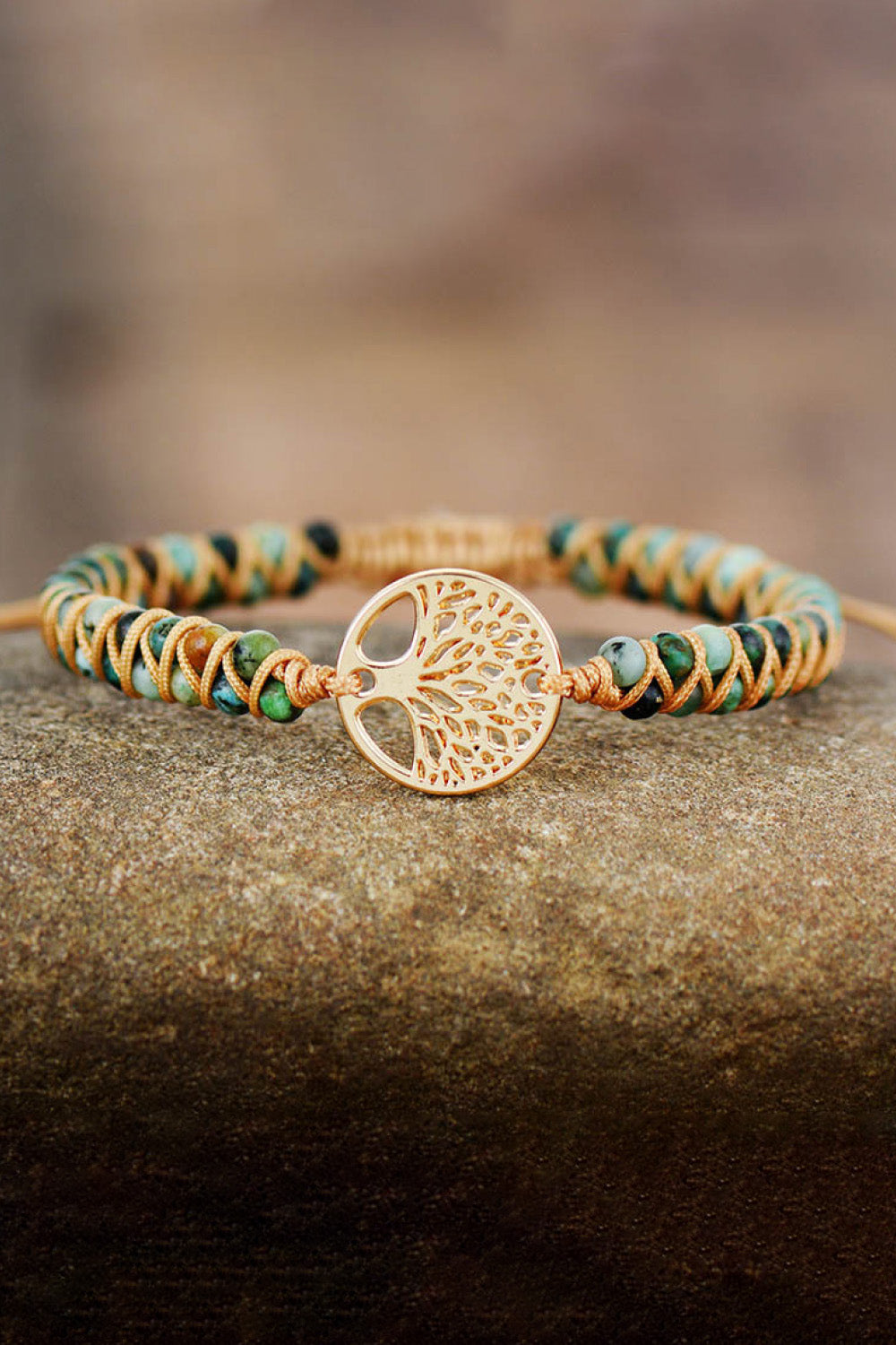 Handmade beaded bracelet with turquoise and orange braided cord, gold tree coin charm
