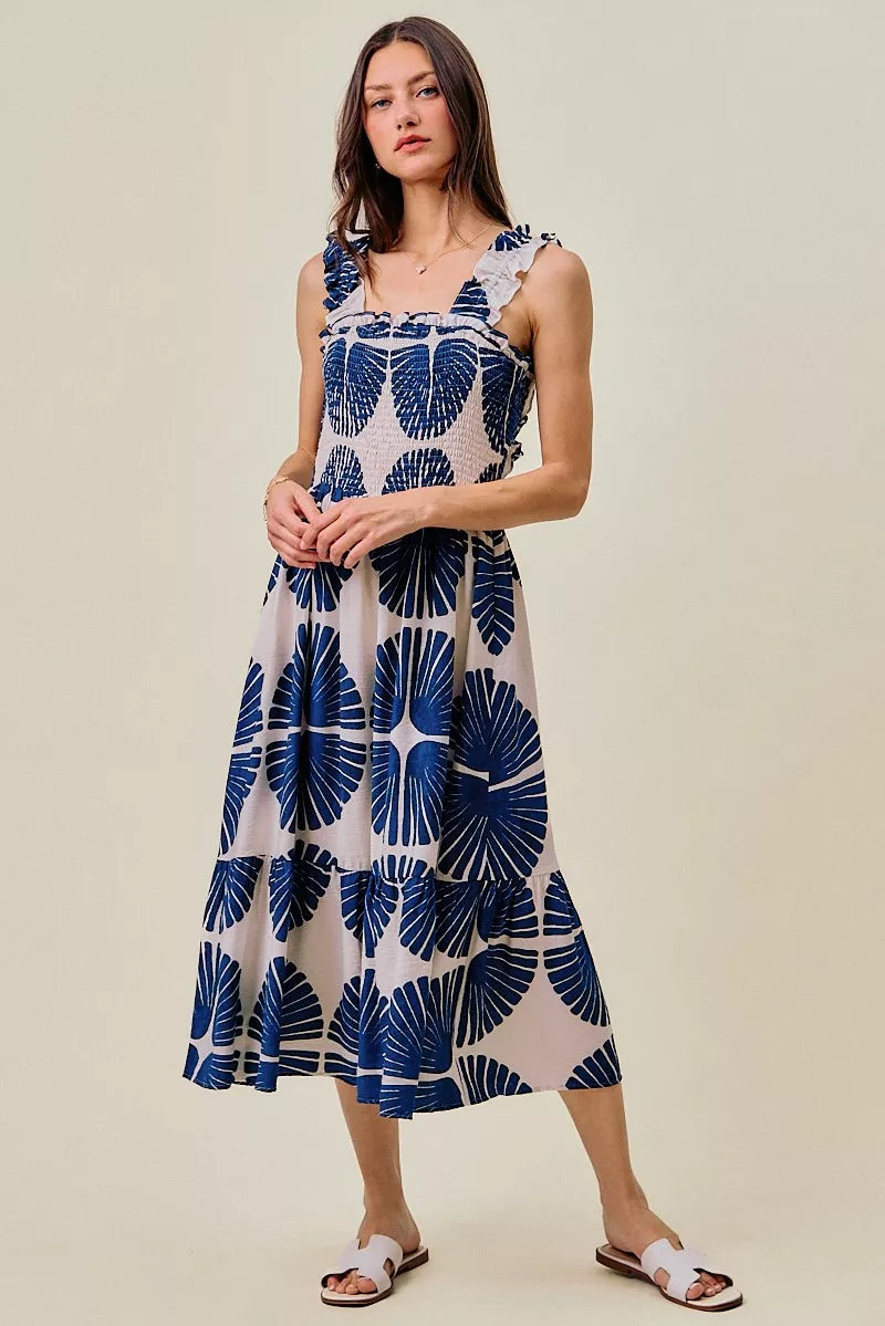 Navy and white abstract print tiered midi dress with smocked bodice and ruffled straps