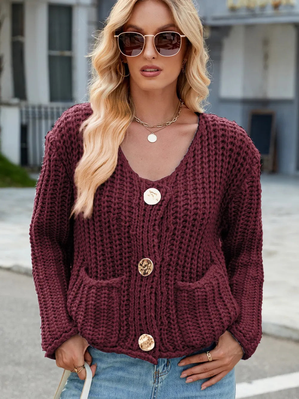 Burgundy chunky knit cardigan, round neck with gold button front and patch pockets
