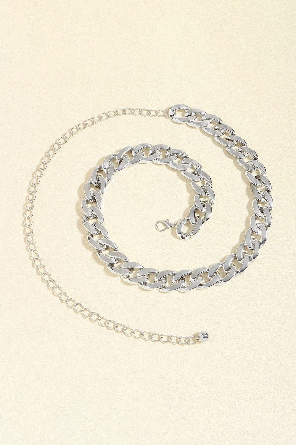 Silver curb chain belt with adjustable strap and circular charm end