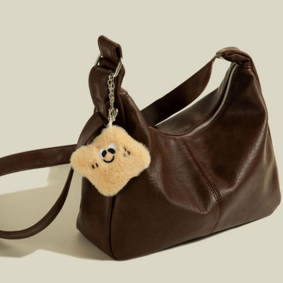 Adjustable Strap Shoulder Bag, brown PU leather, medium, with plush star keychain.
