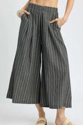 Pinstripe crop palazzo pants with elastic waistband and wide legs, dark with vertical stripes