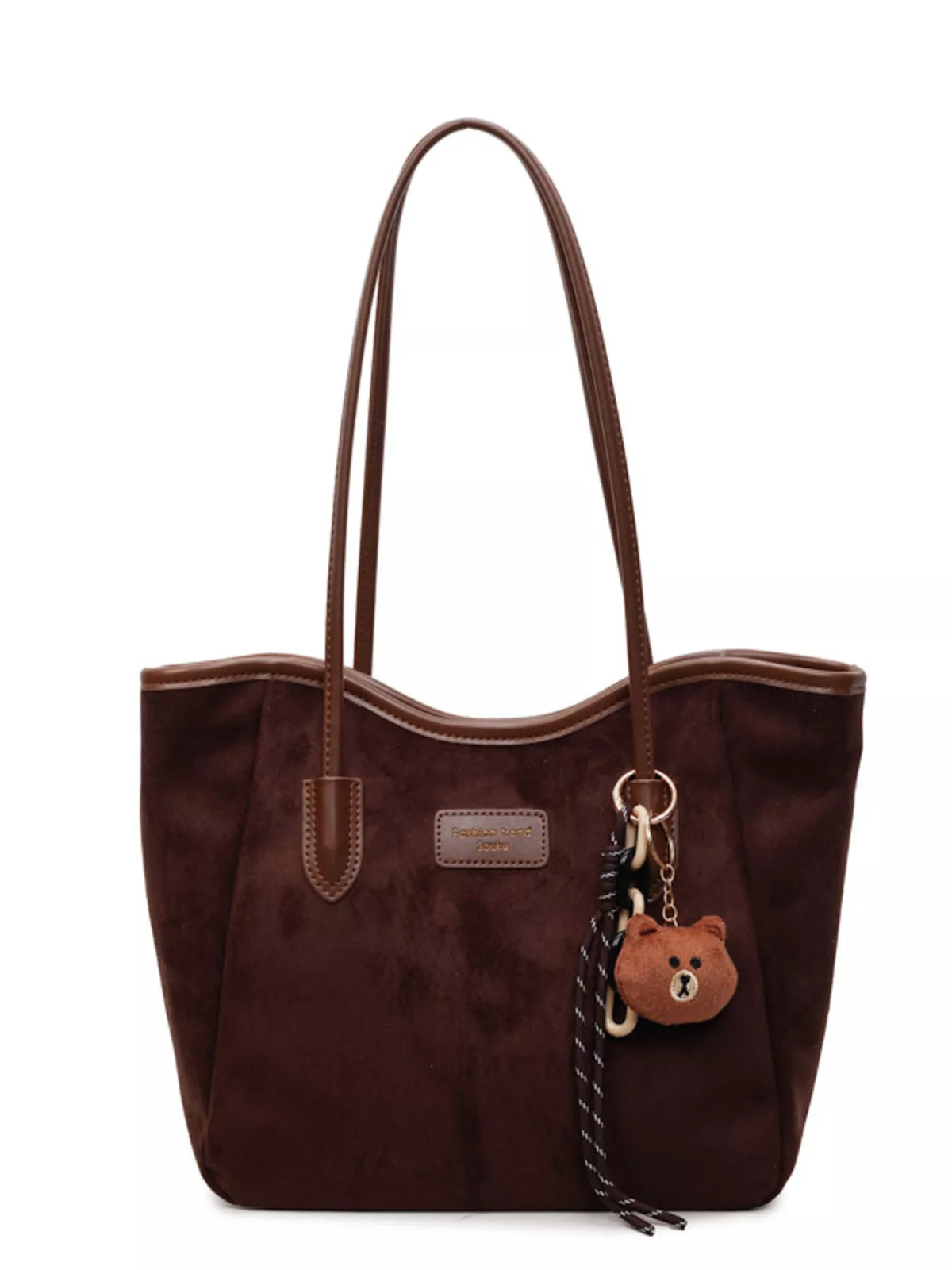 Brown suede tote bag with top handles, front tab pocket, bear keychain and tassel