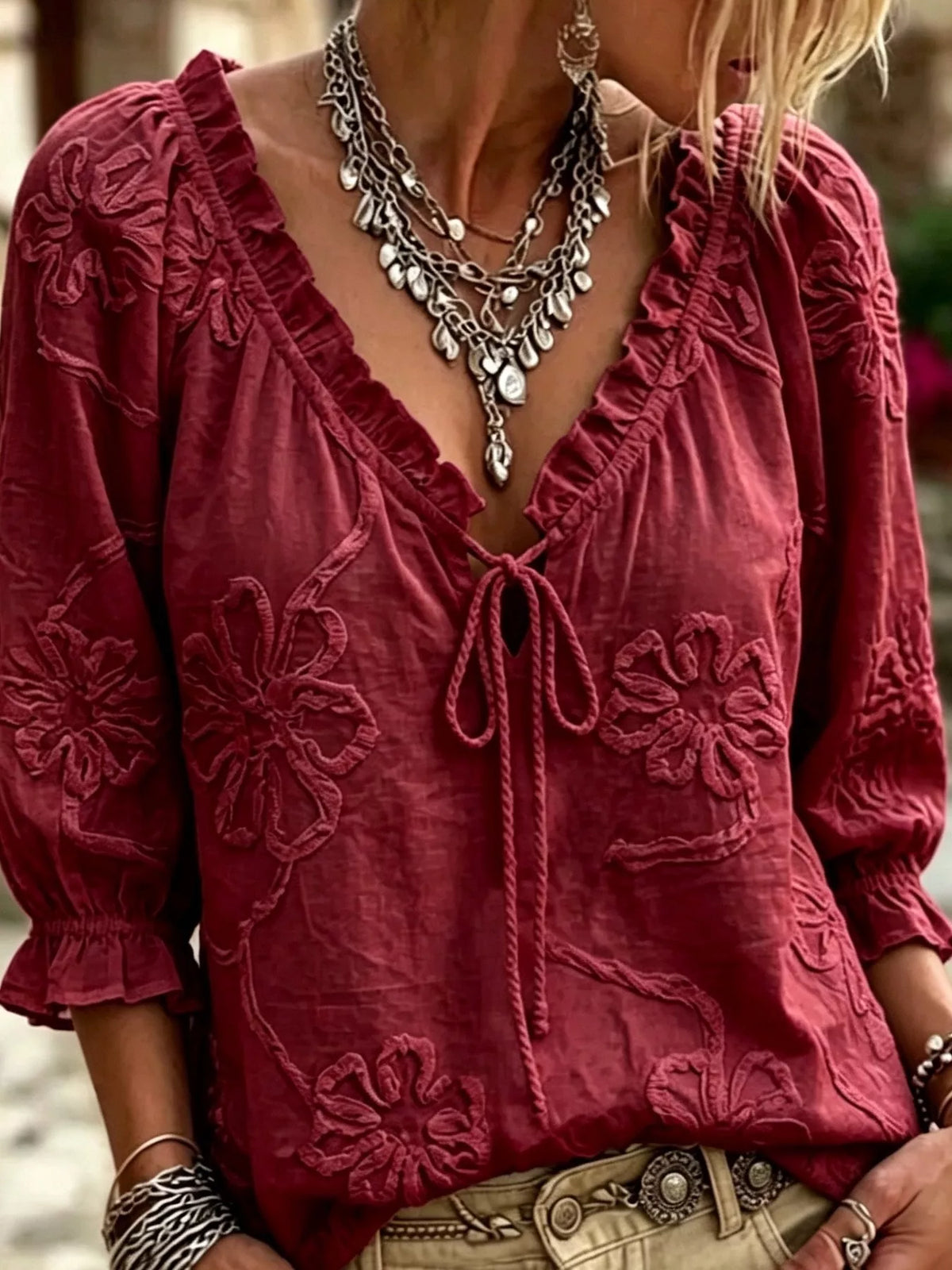 Burgundy floral embroidered tie-neck ruffled blouse with long puff sleeves