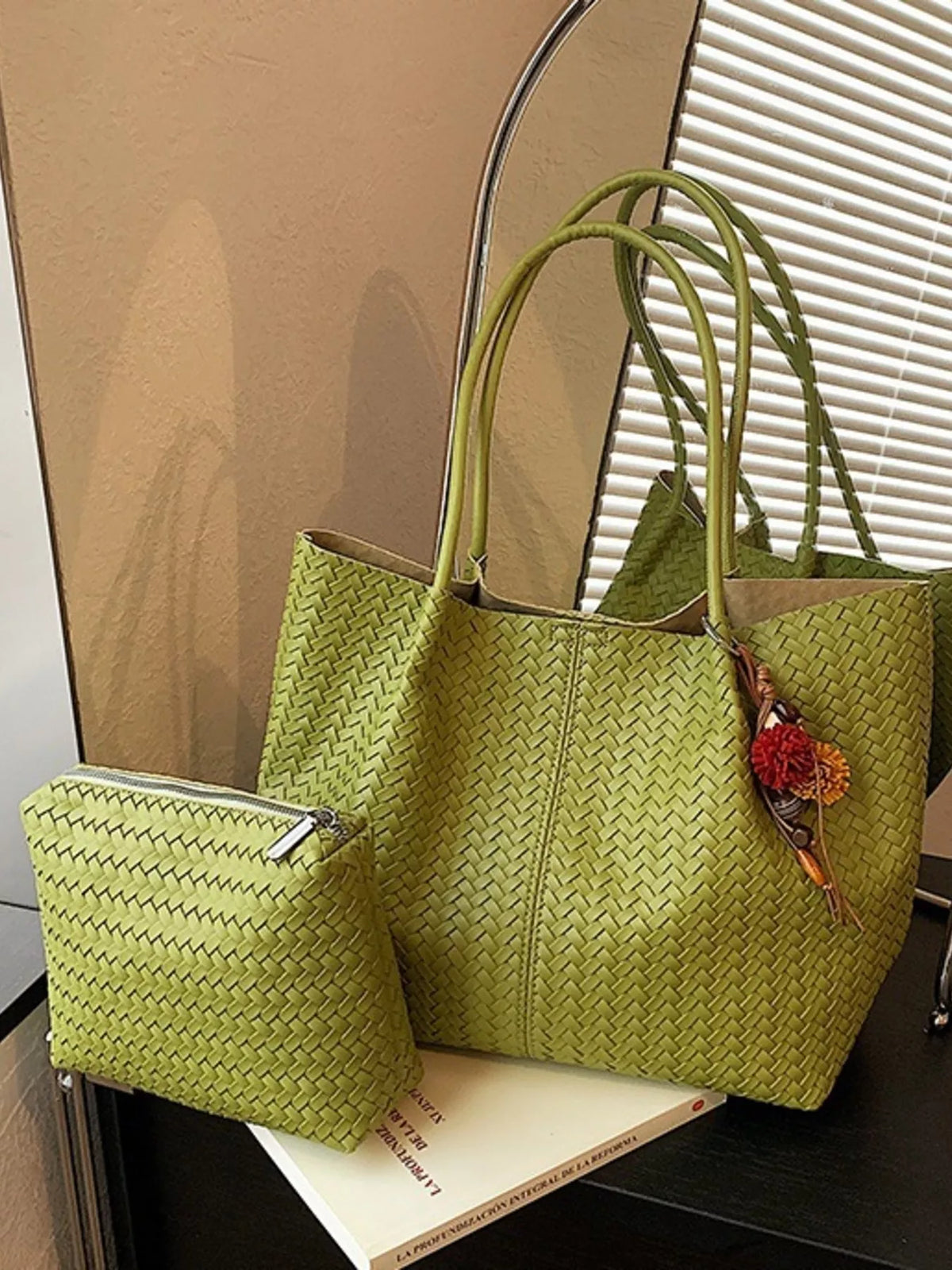 Green woven vegan leather tote bag set with matching small bag and tassel charm