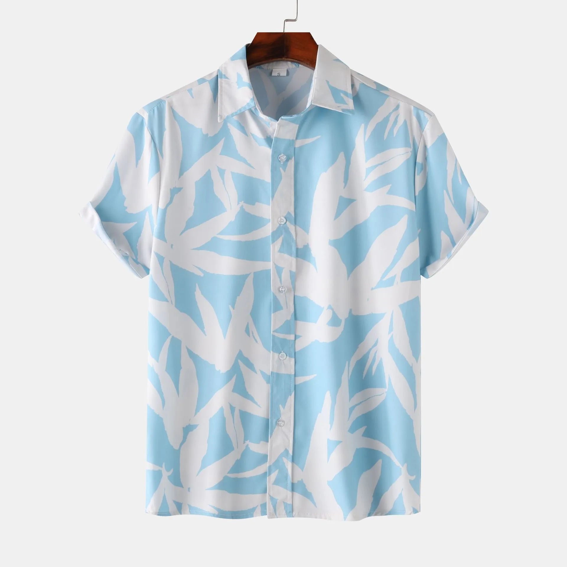 Men’s printed short-sleeve button-up shirt in light blue with abstract leaf and branch pattern.