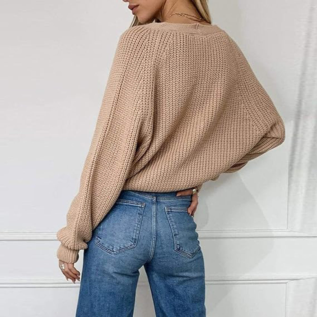 Tan knit V-neck button-front cardigan with long sleeves, shown from the back