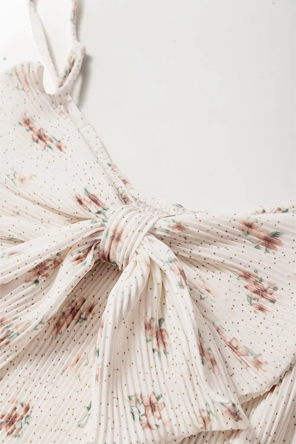 Tied floral bow detail on bow-back cami, white with small floral print
