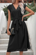Black V-neck pleated dress with tie waist belt, short cap sleeves