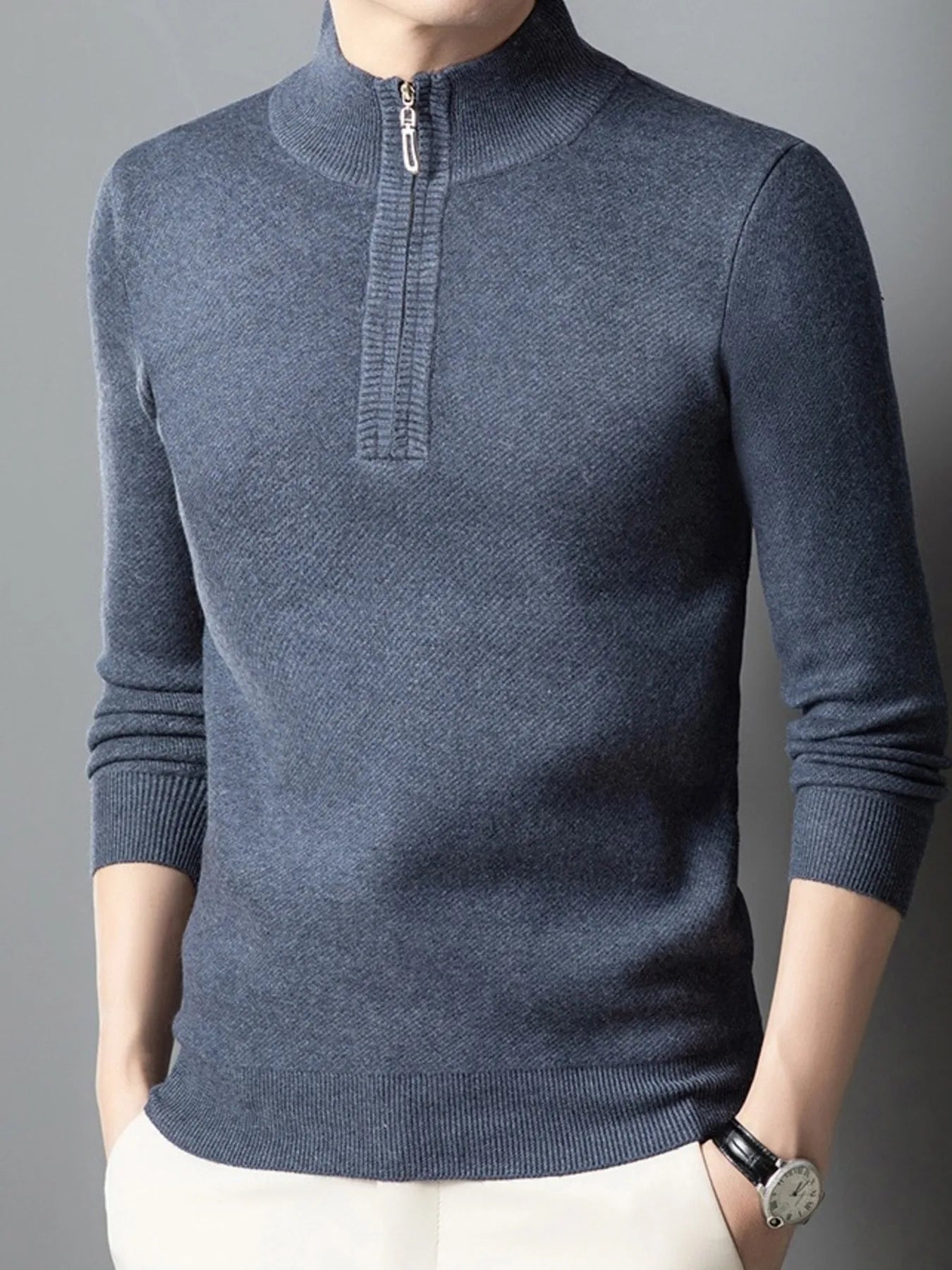 Quarter-zip long-sleeve sweater in blue with ribbed collar and half-zip placket