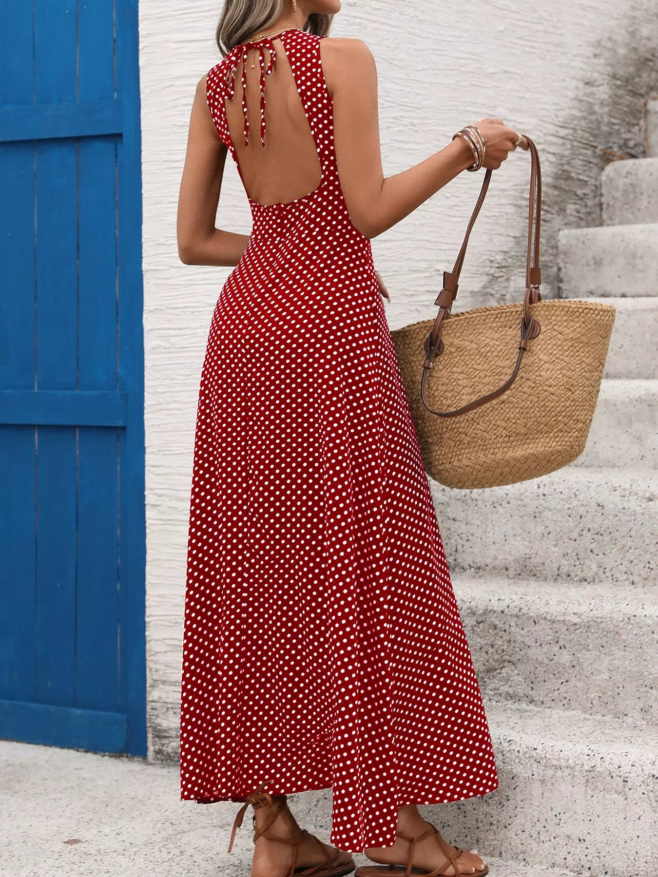 Cedar & Moore Sleeveless Polka Dot Maxi Dress in red with white dots; back-tie, with woven tote bag.