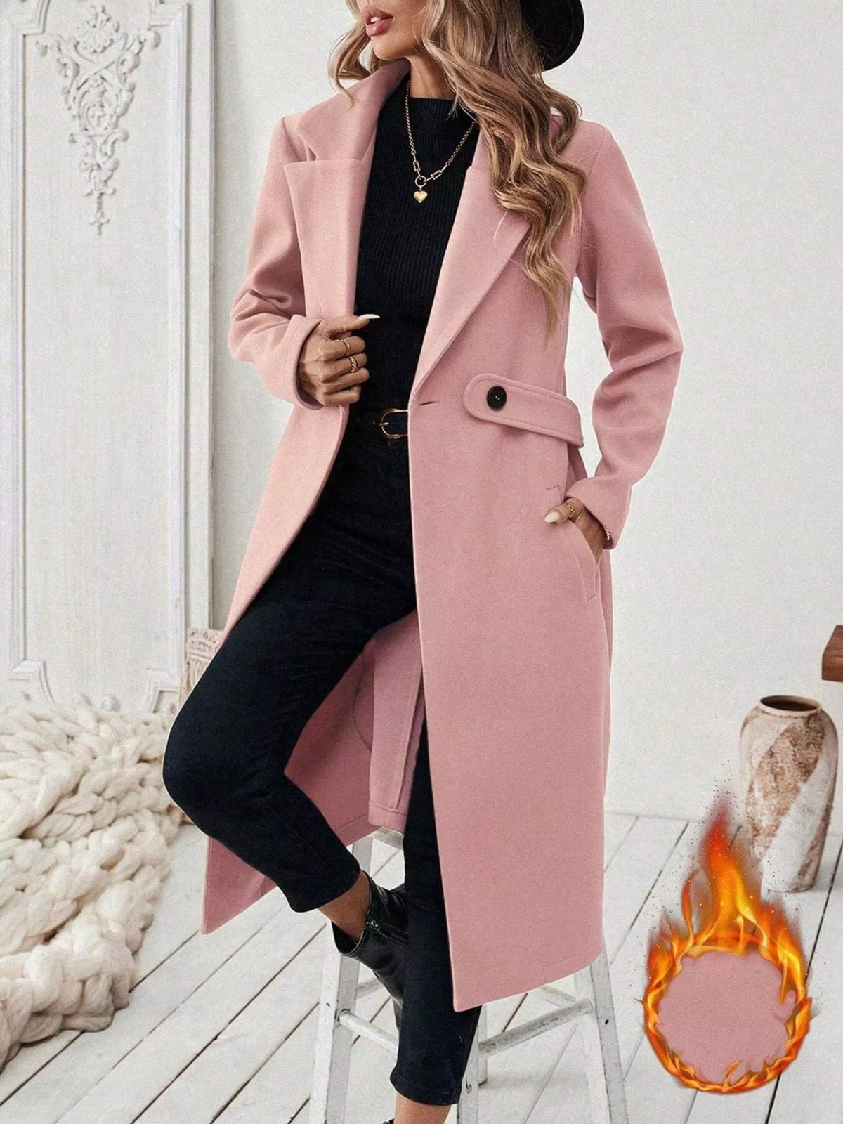 Blush pink longline coat with notched lapels, flap pockets, and button-front closure