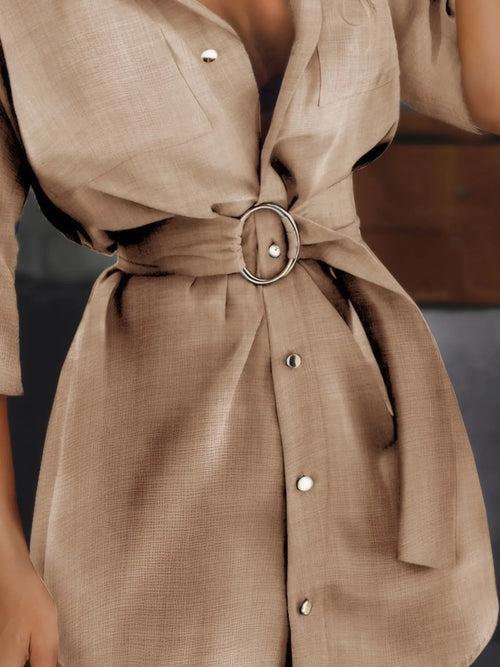 Tan button-front shirt dress with waist belt and round button placket detail