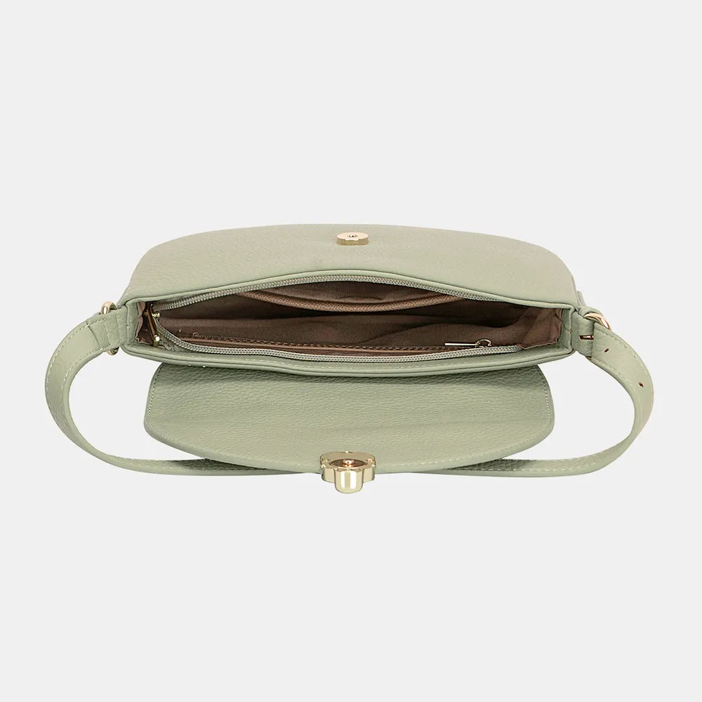 Olive half-moon shoulder bag open at top, showing inner lining and metal buckle clasp.