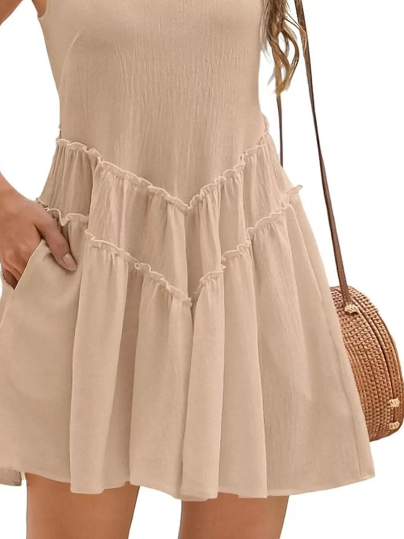 Round-neck sleeveless beige mini dress with pockets and frill-tiered hem