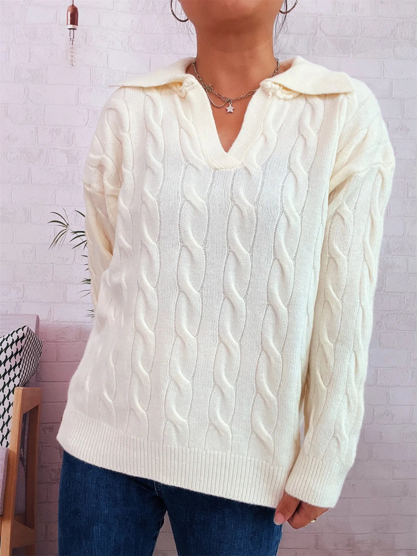 Cream cable knit Johnny-collar sweater with raised cable texture, long sleeves