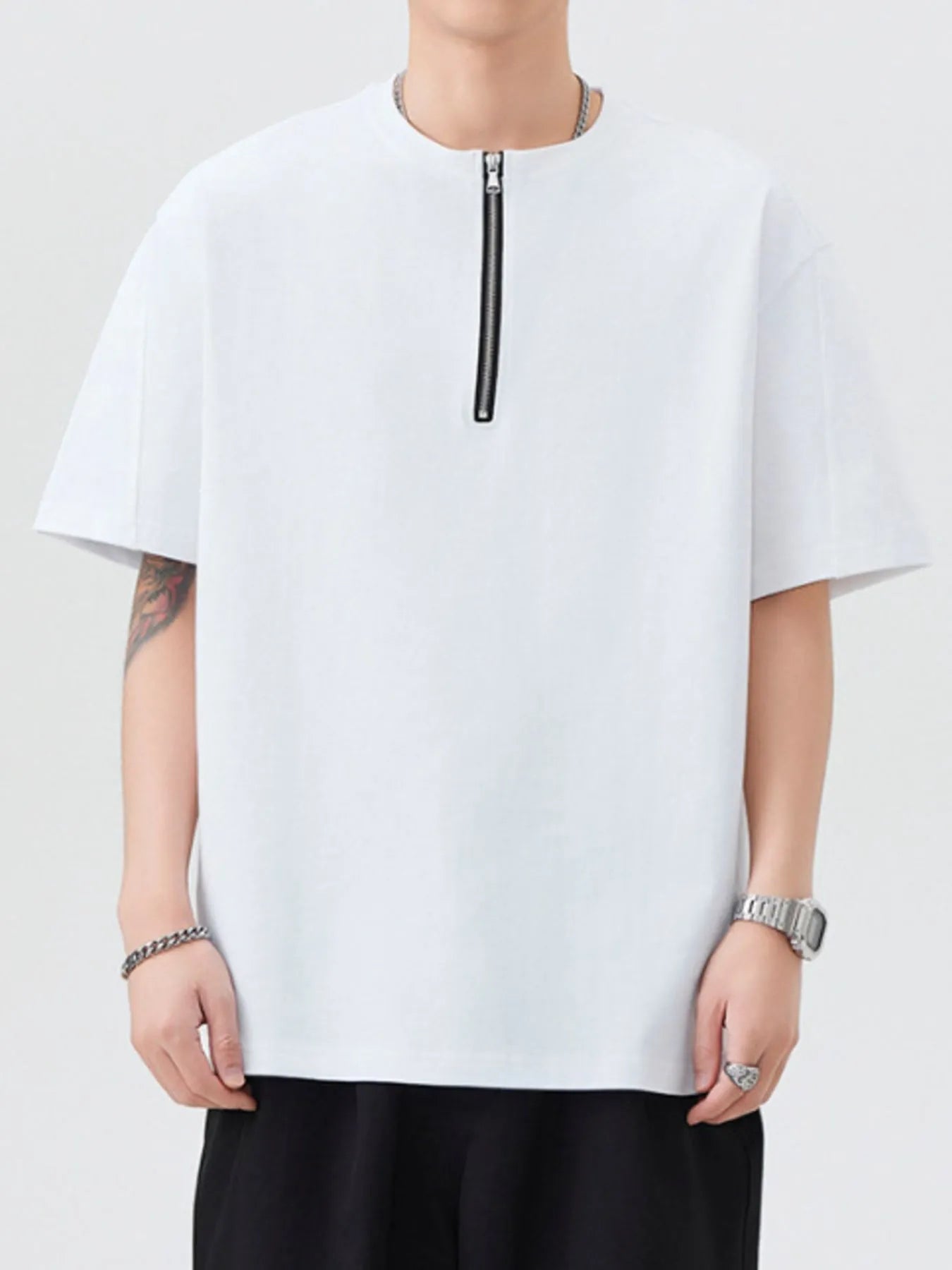 White oversized half-zip T-shirt with short sleeves and front zipper