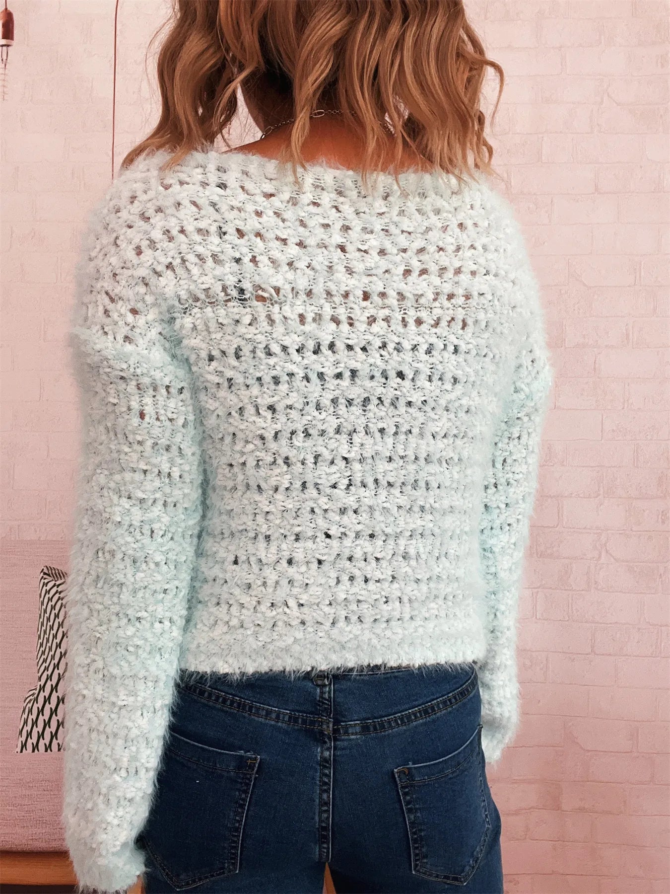White crochet sweater, round neck and dropped shoulders, textured knit (back view)