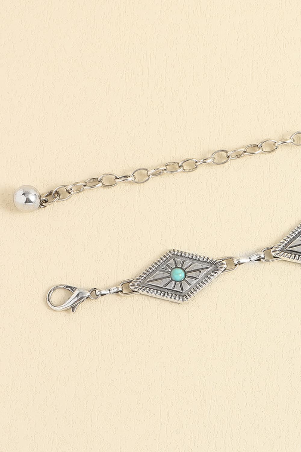 Turquoise inlaid eye charm belt with silver chain and small toggle end
