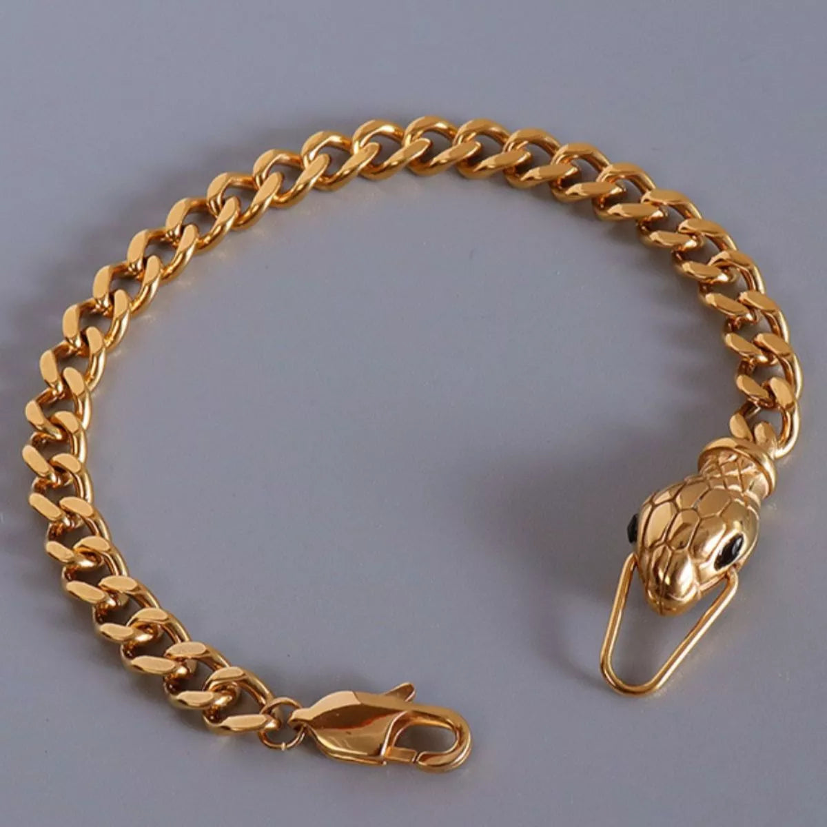 Gold snake-head chain bracelet with lobster clasp closure