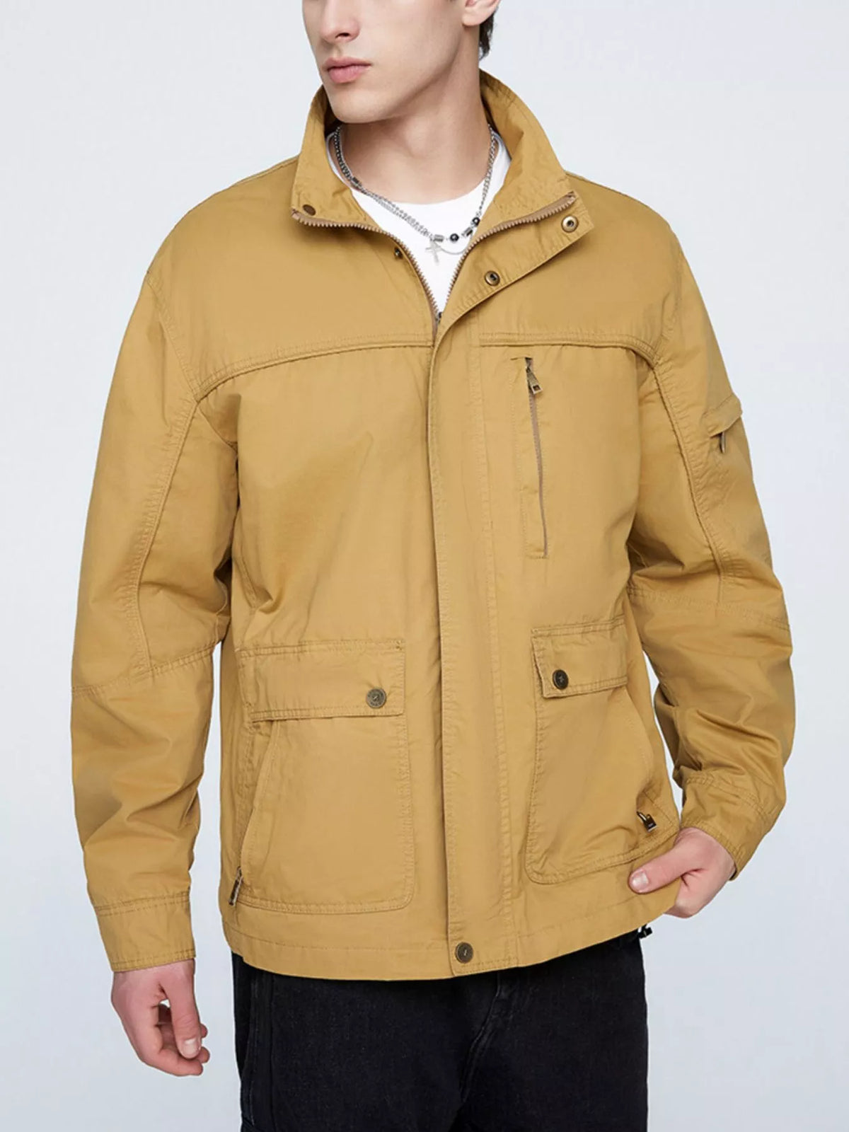 Khaki zip-up jacket with snap pockets and stand collar, chest zipper