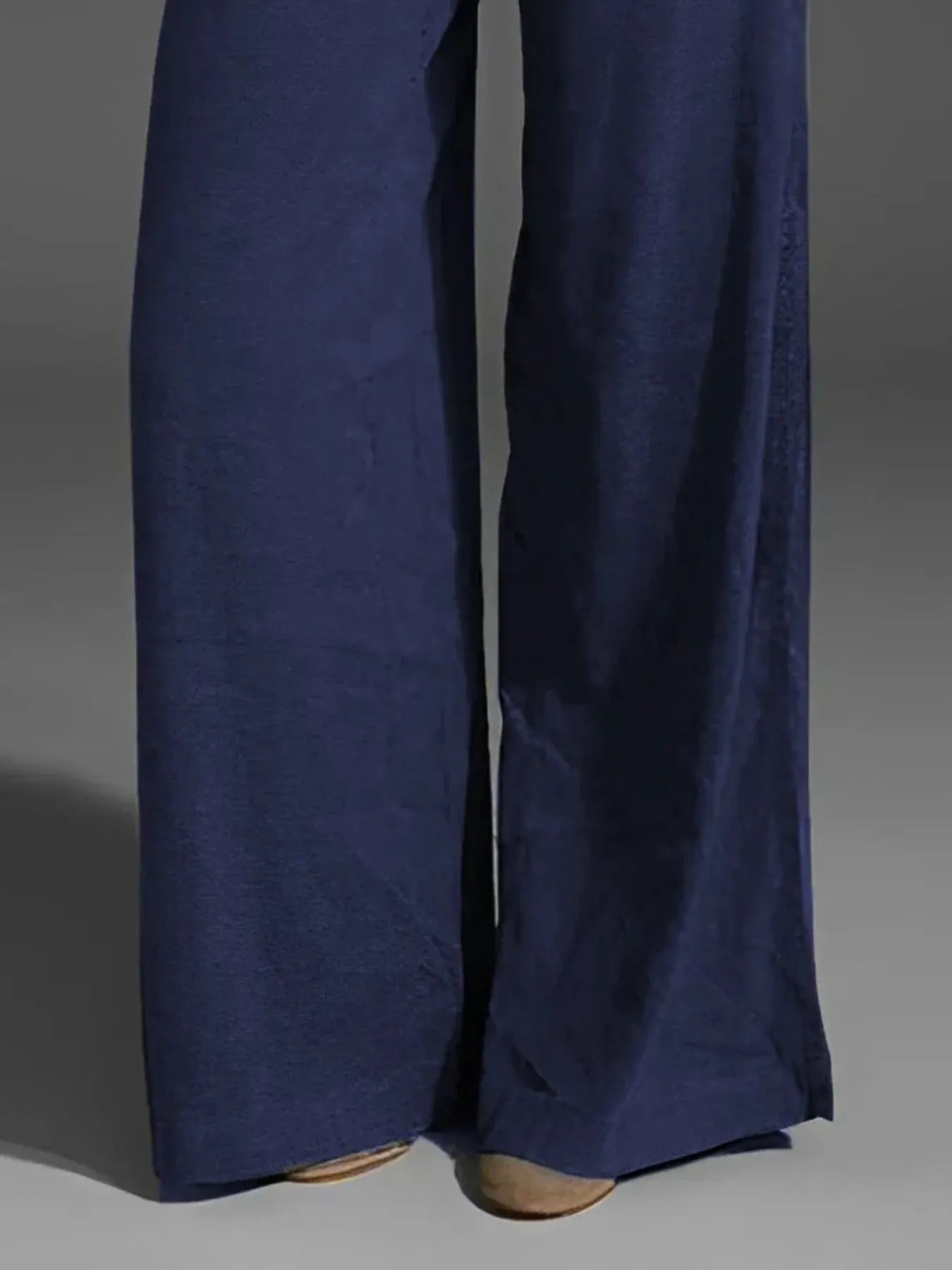 Dark navy wide-leg pants with pockets and button-front closure