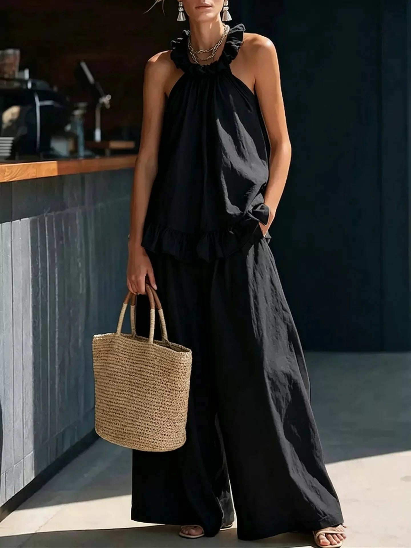 Black ruffled halter neck top and wide-leg pants set, draped halter with ruffle trim