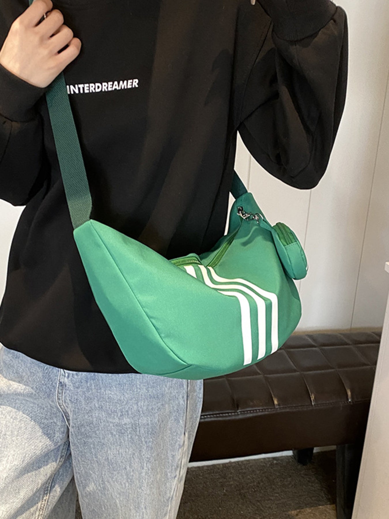 Striped green crossbody bag with coin purse and adjustable strap
