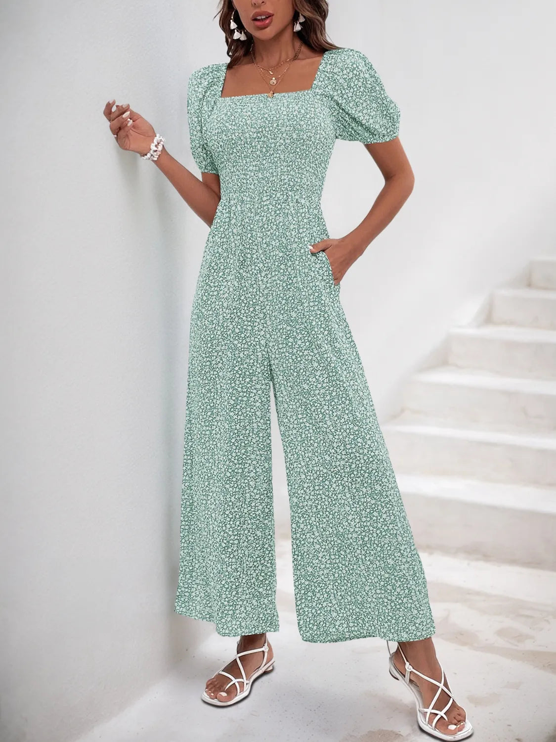 Front view green printed square-neck puff-sleeve jumpsuit with wide-leg pants