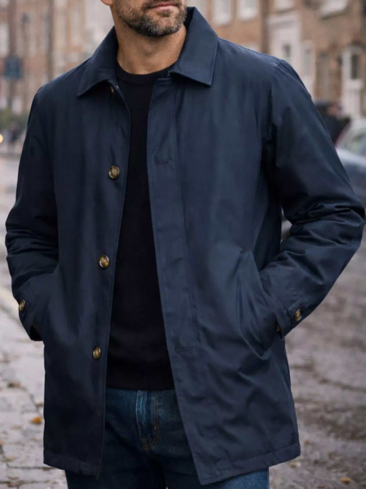 Men's navy single-breasted trench coat with notched collar and button front